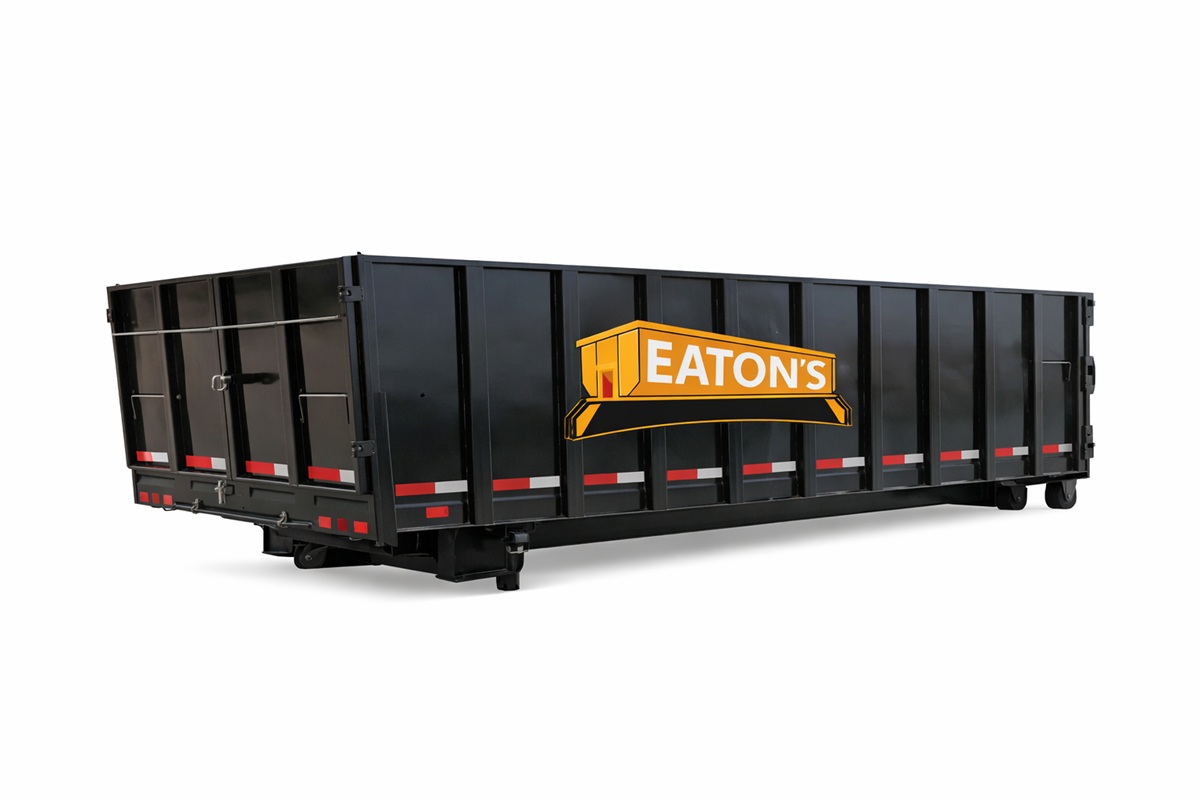 Eaton’s Construction black roll-off dumpster container isolated on white background for residential and commercial waste removal projects.